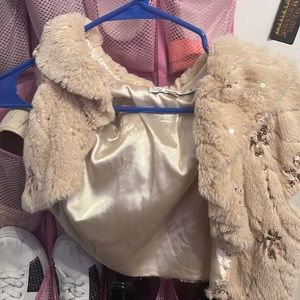 It’s a yellow beige kind of jacket with shimmer and I think it’s a small size